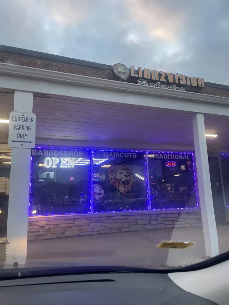 Lionzvision Barbershop sign over the storefront on Bloomingdale Rd